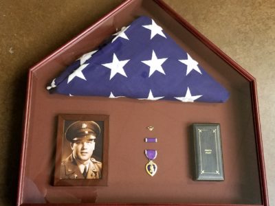 Shadow box of purple heart and flag